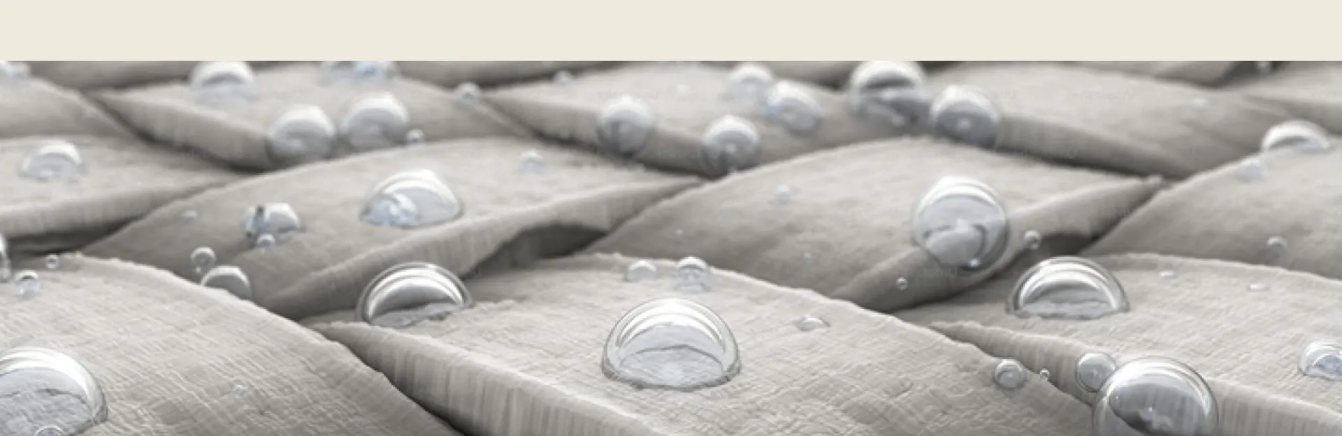 Close-up of woven CiCLO® polyester fabric with water droplets beading on the fibres